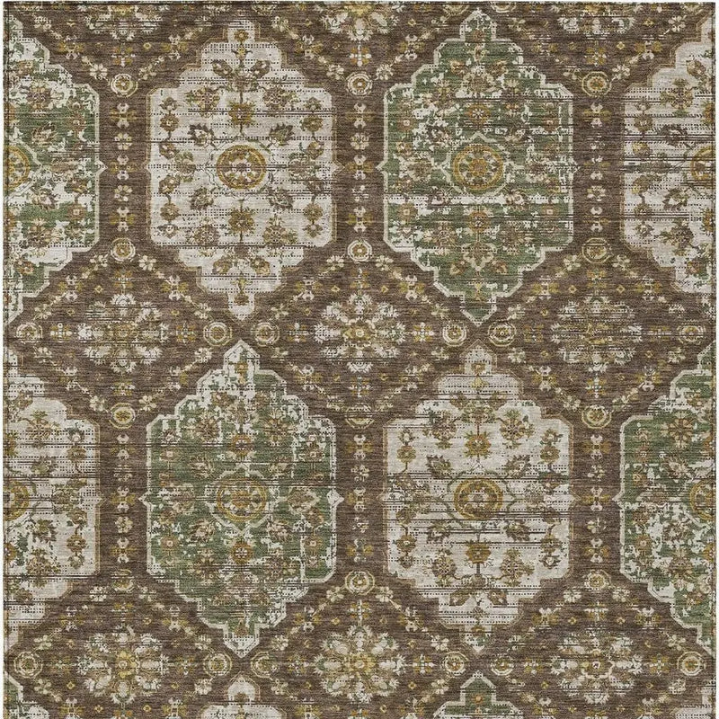 Vintage-inspired brown and green area rug with intricate floral patterns and a distressed finish.