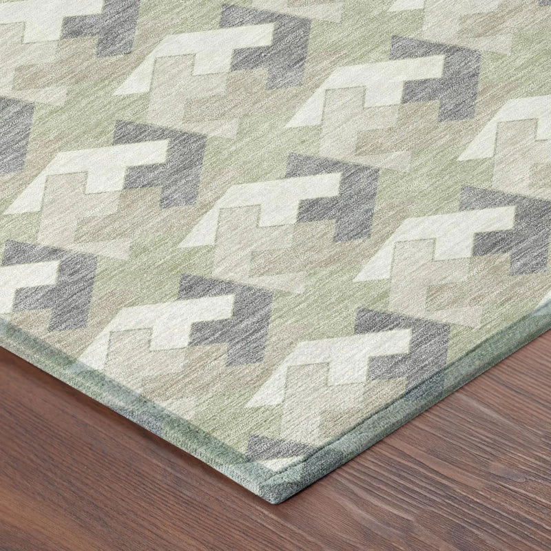 Light green geometric patterned area rug in soft, durable material, perfect for modern home decor.