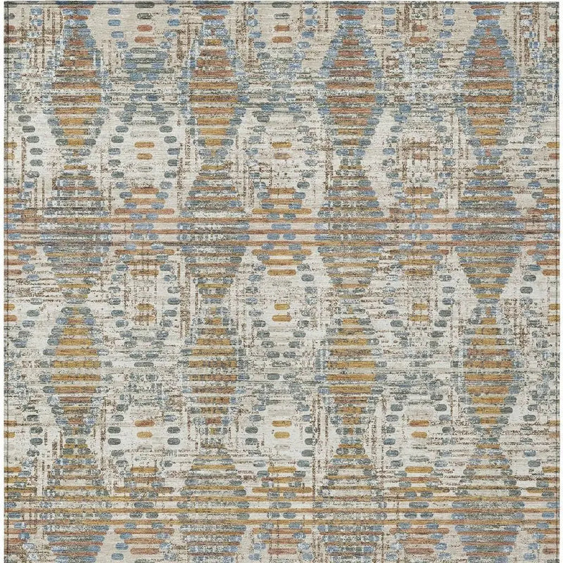 Multicolored abstract area rug in blue, orange, and cream, featuring a modern geometric pattern, perfect for contemporary decor.