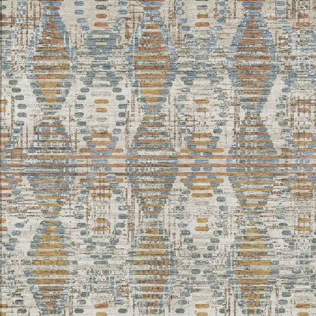 Multicolored geometric area rug in blue, orange, and cream; made from soft, durable synthetic material.