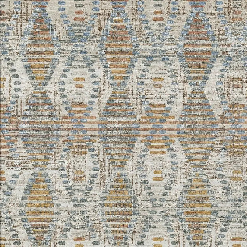Multicolored geometric area rug in blue, orange, and cream; made from soft, durable synthetic material.