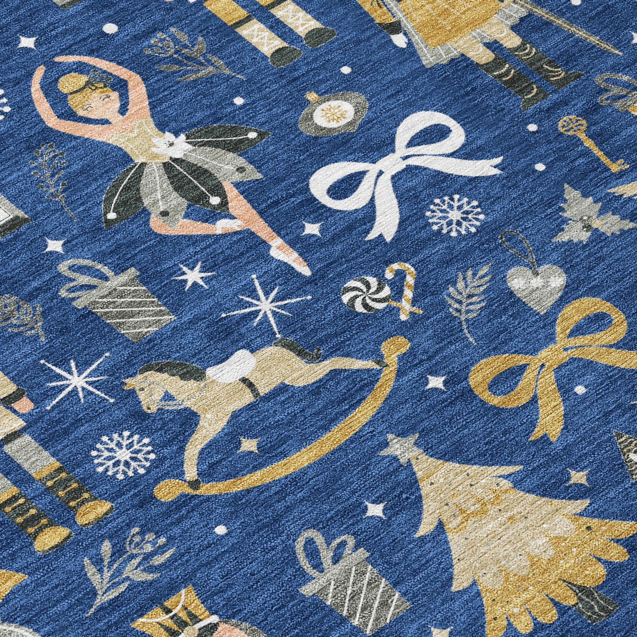 Blue festive area rug featuring gold and silver ballet dancers, Christmas trees, gifts, and holiday motifs.