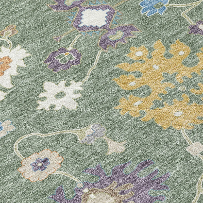 Multicolored floral area rug with green background, featuring intricate purple, yellow, and white patterns, soft polypropylene material.