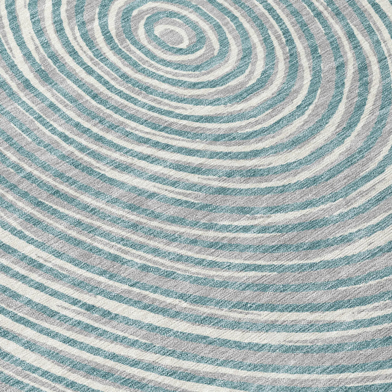 Blue and white circular patterned area rug, made from soft, durable fibers, ideal for modern home decor.
