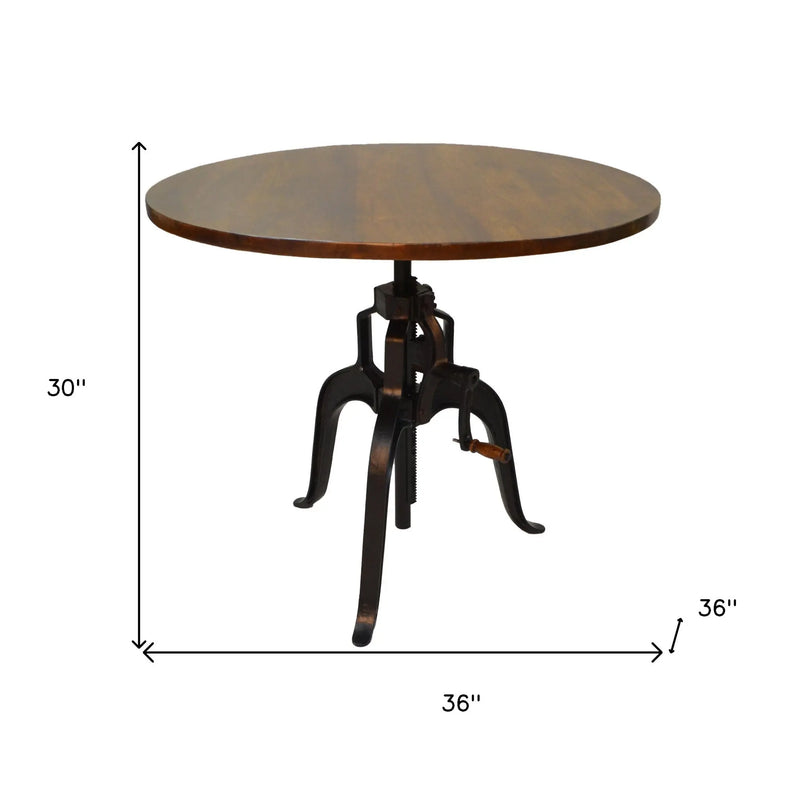 Adjustable Height Brown And Black Solid Wood And Iron Pedestal Base Round Top Dining Table Homeroots Kitchen & Dining