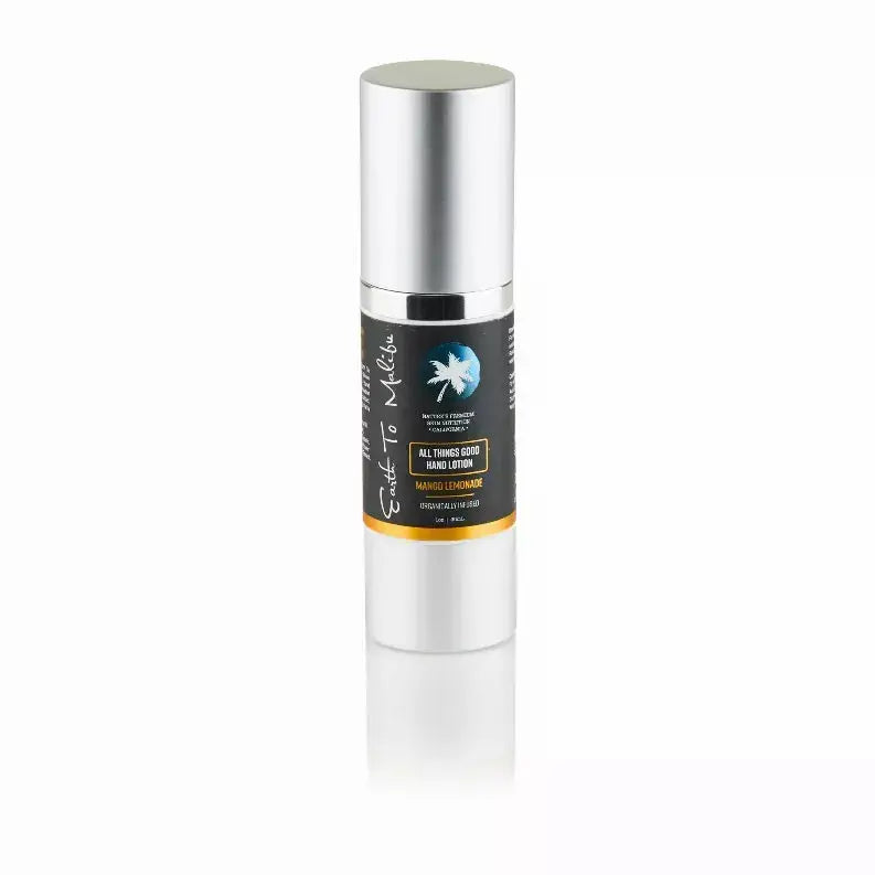 Clear glass pump bottle with a silver cap, featuring 'All Things Good Hand Lotion' label in black and orange.