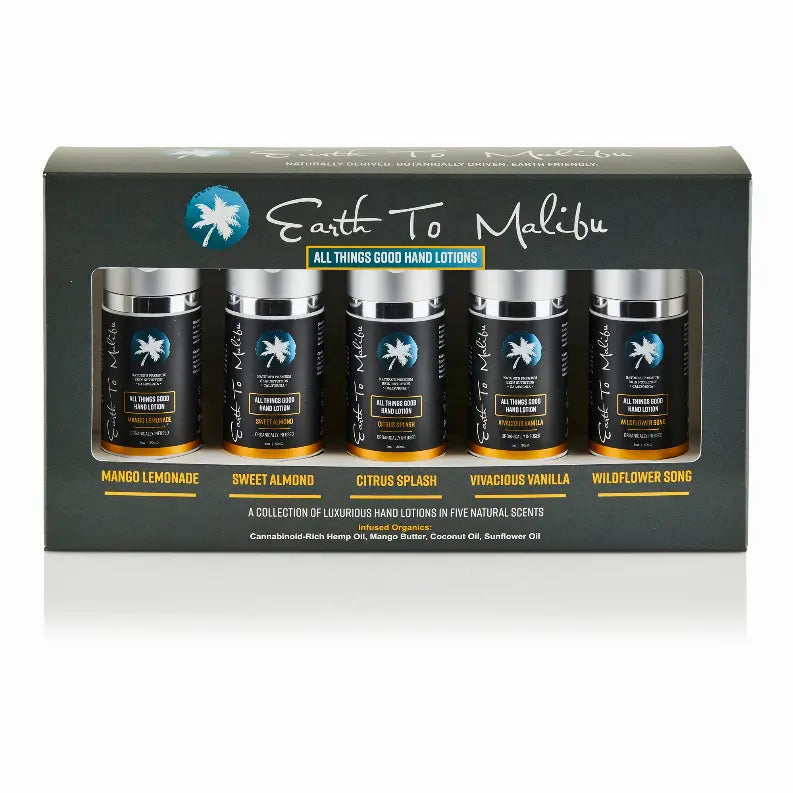 Set of five hand lotions in sleek black jars, featuring Mango Lemonade, Sweet Almond, Citrus Splash, Vivacious Vanilla, and Wildflower Song.