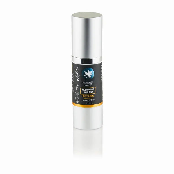 Satin silver pump bottle of revitalizing serum with black and orange label, 30ml, for radiant skin.