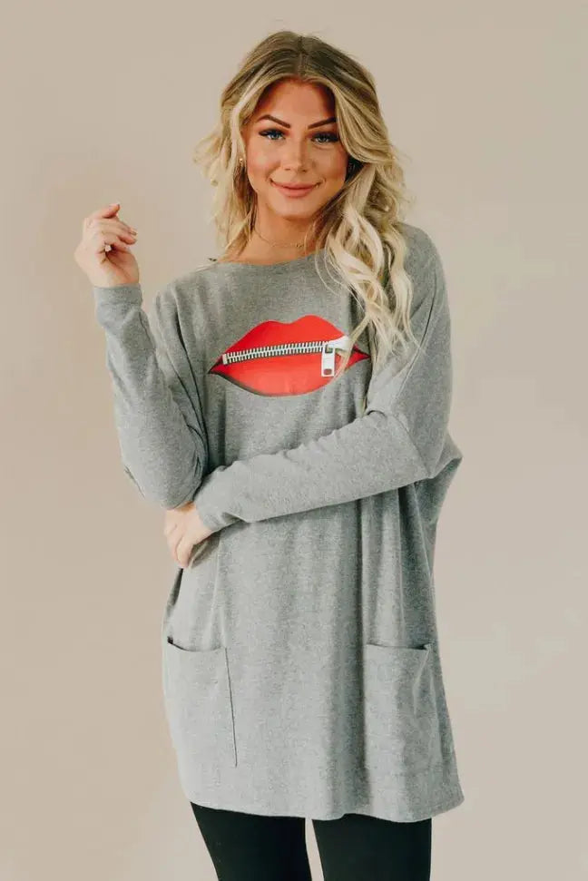 All Zipped Up Lips Pocket Tunic Stay Warm in Style