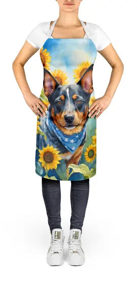 Dog-themed apron featuring a blue heeler with a bandana, set against vibrant sunflowers, in a colorful design.