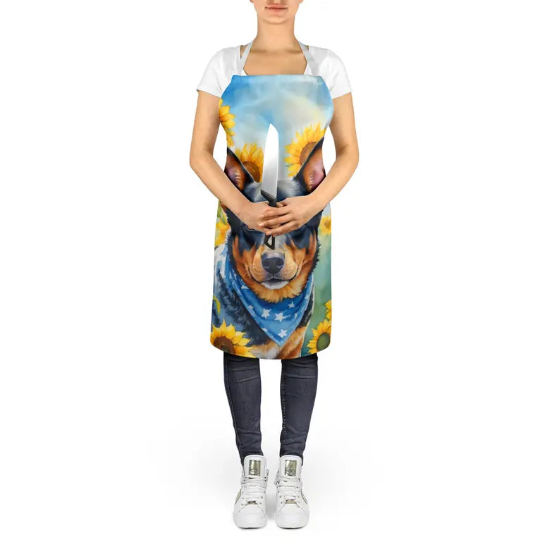 Colorful dog-printed apron with sunflower design, made from durable fabric, perfect for kitchen or crafting.