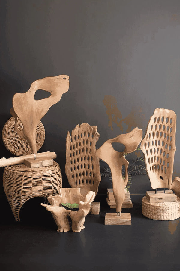 Natural wooden decor sculptures in various shapes and sizes, showcasing a light brown color and artistic design.