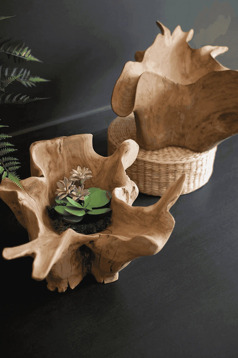 Natural wood decorative bowl in light brown, featuring organic shapes, with moss and faux flowers. Ideal for home décor.