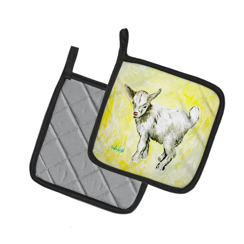 White goat print pot holder with a yellow background and black trim, made of durable cotton with quilted texture.