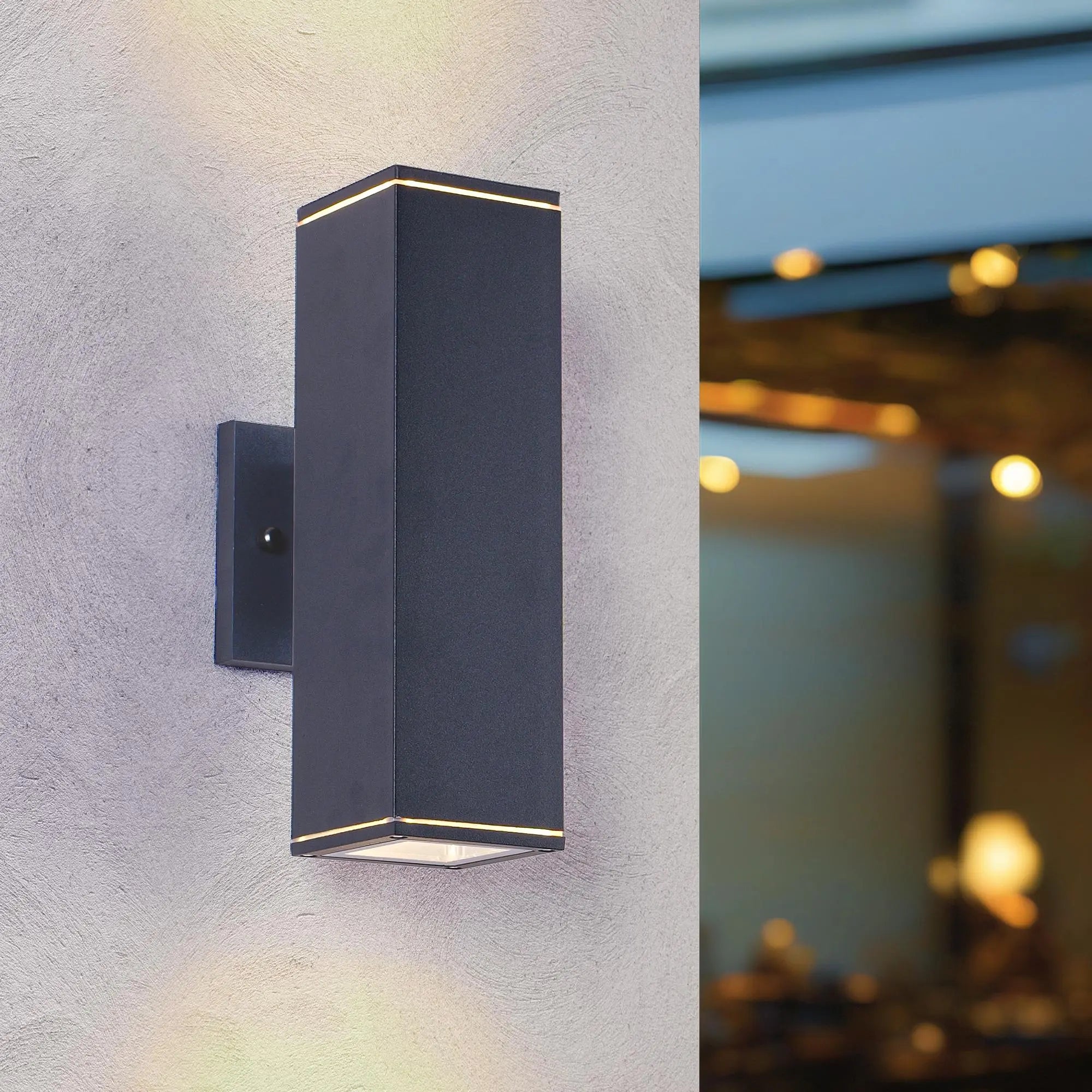 Black modern LED wall sconce with a sleek rectangular design and subtle warm light accents. Ideal for contemporary decor.