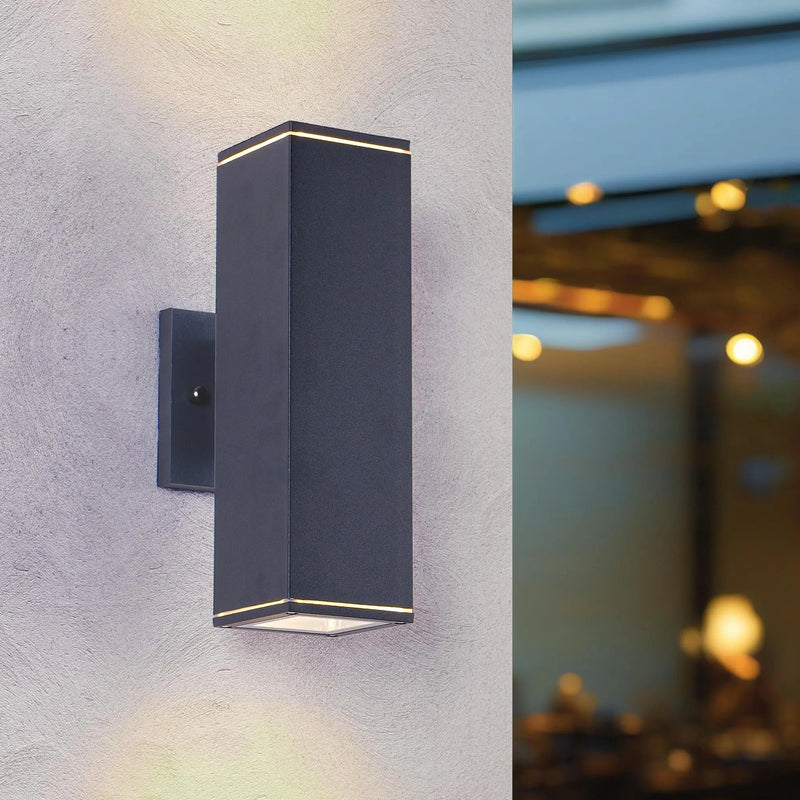 Black modern LED wall sconce with a sleek rectangular design and subtle warm light accents. Ideal for contemporary decor.