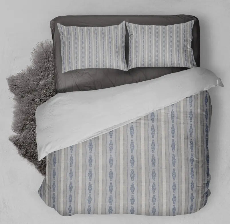 Light blue and cream striped duvet cover set with gray sheets, featuring a modern boho style and soft fabric.