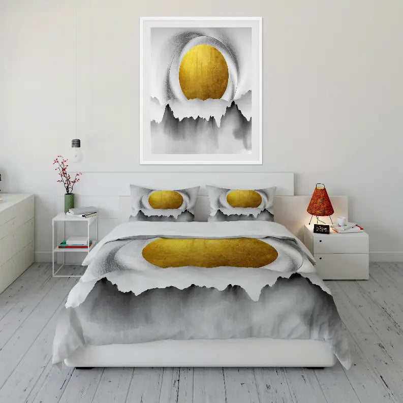 Gold and gray abstract bedding set with matching pillow covers, styled in a modern bedroom with minimalist decor.