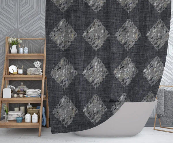Gray geometric patterned shower curtain in textured fabric, adding modern style to bathroom decor.
