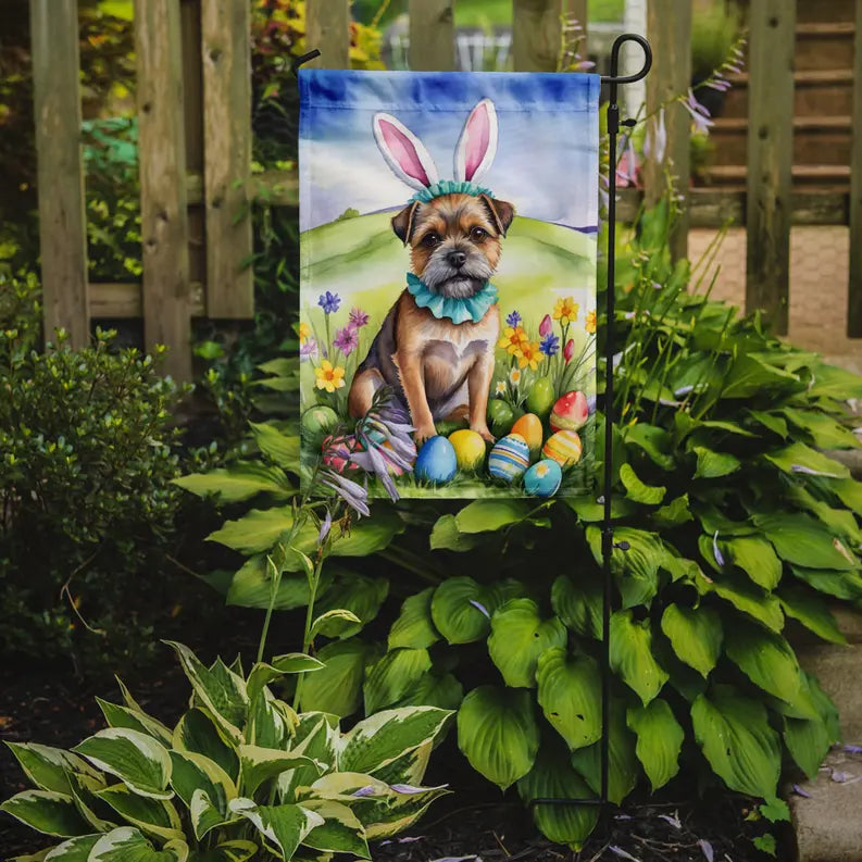Easter garden flag featuring a tan dog with bunny ears among colorful eggs and flowers, vibrant design, durable material.