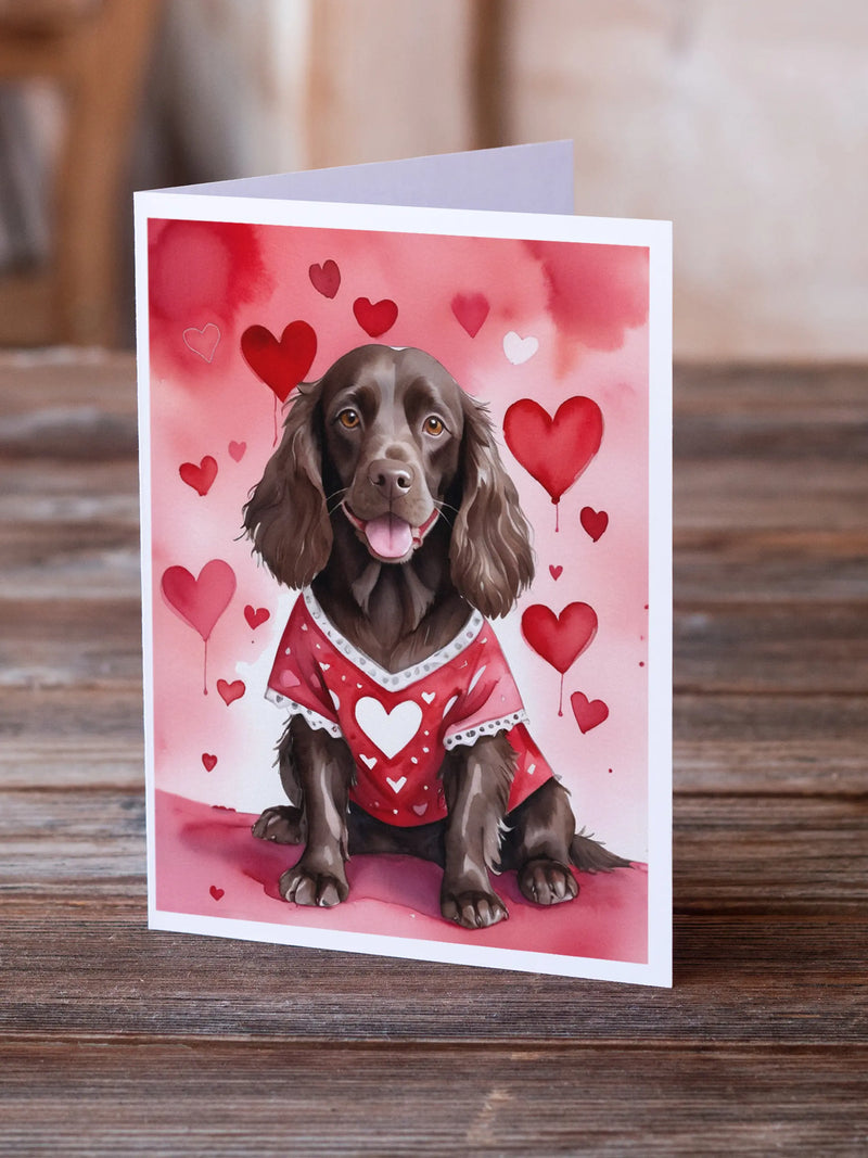 Cute dog valentine's card with a brown spaniel in a red heart-patterned sweater, set against a pink heart backdrop.