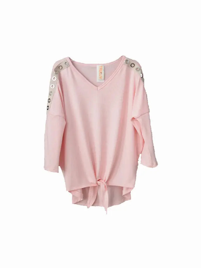 Light pink oversized top with a V-neck, embellished silver buttons on shoulders, and a trendy tie-front design.