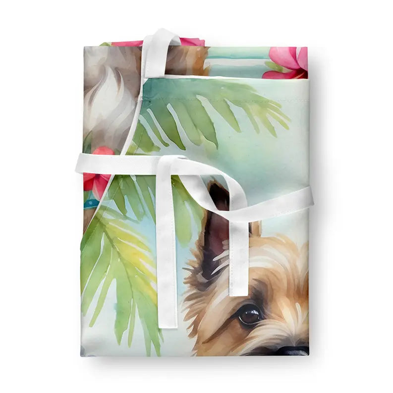 Watercolor dog print gift wrap in vibrant colors with floral and tropical leaf design, tied with a white satin ribbon.