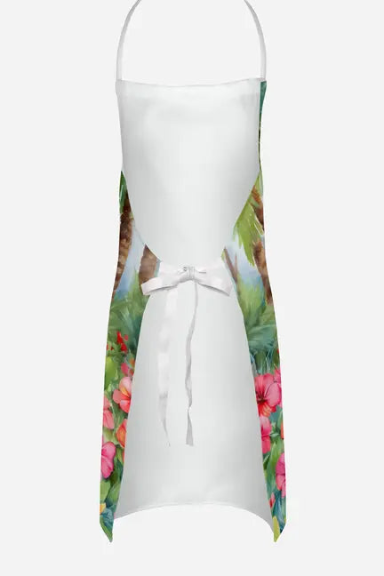 White kitchen apron with vibrant tropical floral print and palm leaves, featuring a adjustable ribbon tie.