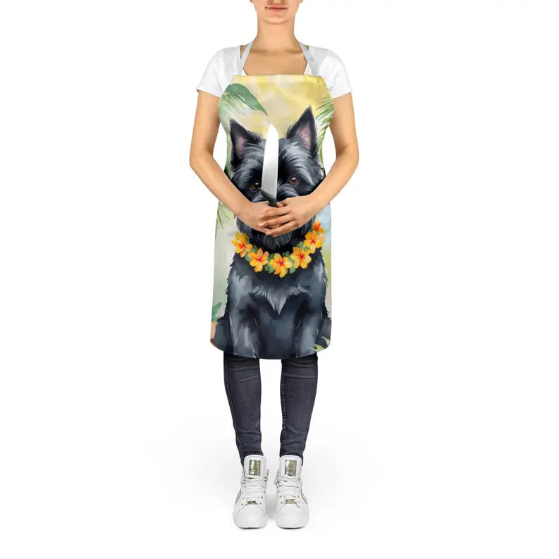 Colorful dog-themed apron with tropical flowers, featuring a black dog design, ideal for kitchen or grilling use.