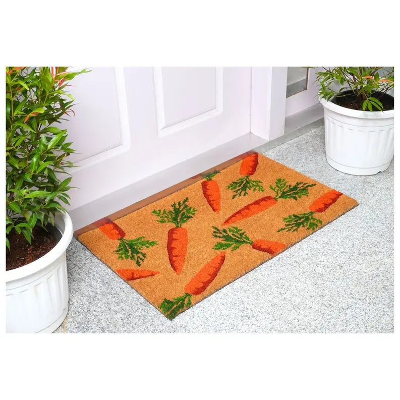 Carrot-themed coir doormat, orange and green design on a natural brown background, ideal for welcoming guests.