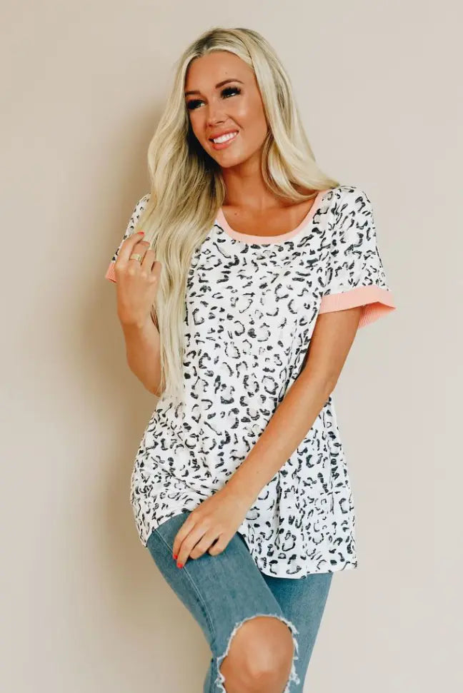 White leopard print t-shirt with coral sleeves, made of soft cotton, stylish and comfortable for casual wear.