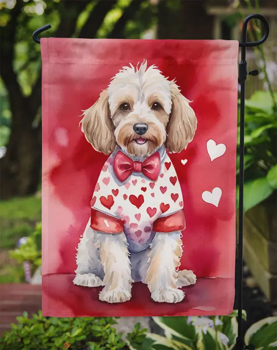 Whimsical dog flag featuring a fluffy beige dog in a hearts-patterned shirt on a vibrant red background.