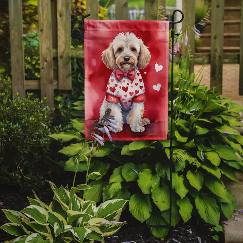 Adorable red garden flag with a dog in a heart-patterned shirt, featuring a bow tie, perfect for pet lovers.