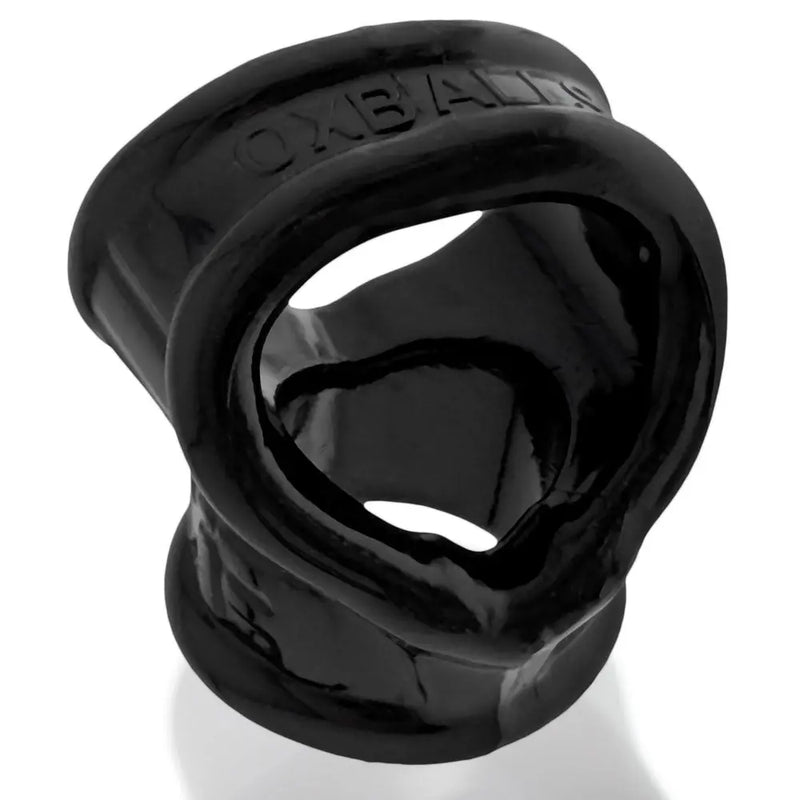 Black silicone cock ring with heart-shaped opening, featuring a smooth finish and flexible design for comfort and support.