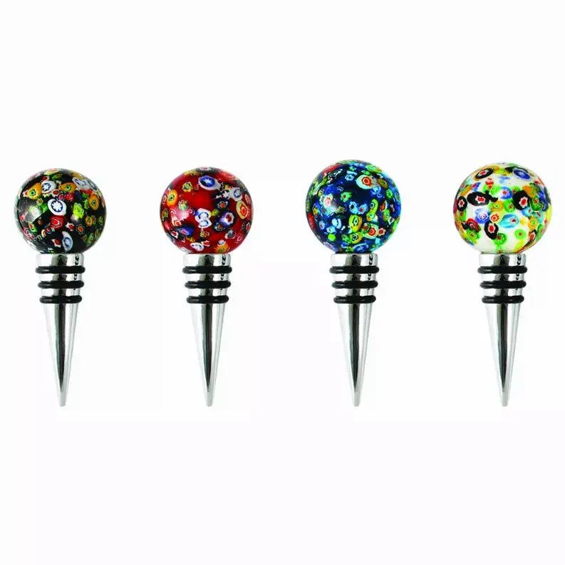 Colorful glass wine stoppers with floral designs, featuring black, red, blue, and green accents and stainless steel bases.