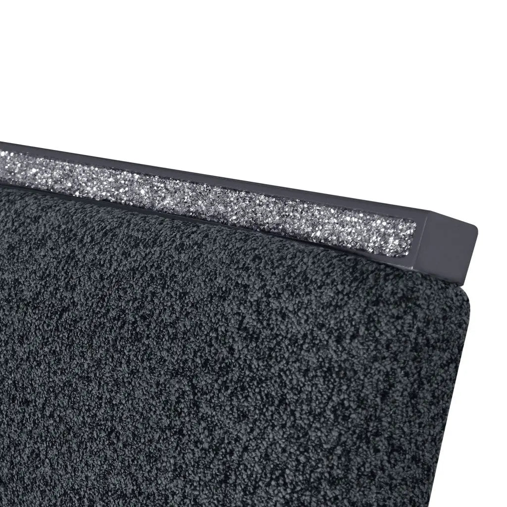 Elegant gray upholstered headboard with sparkling silver trim, perfect for modern bedroom decor.