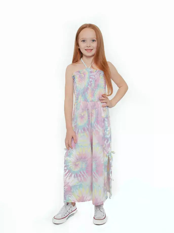 Pastel tie-dye girls' jumpsuit with smocked bodice, adjustable straps, and side pockets. Perfect for summer outings.
