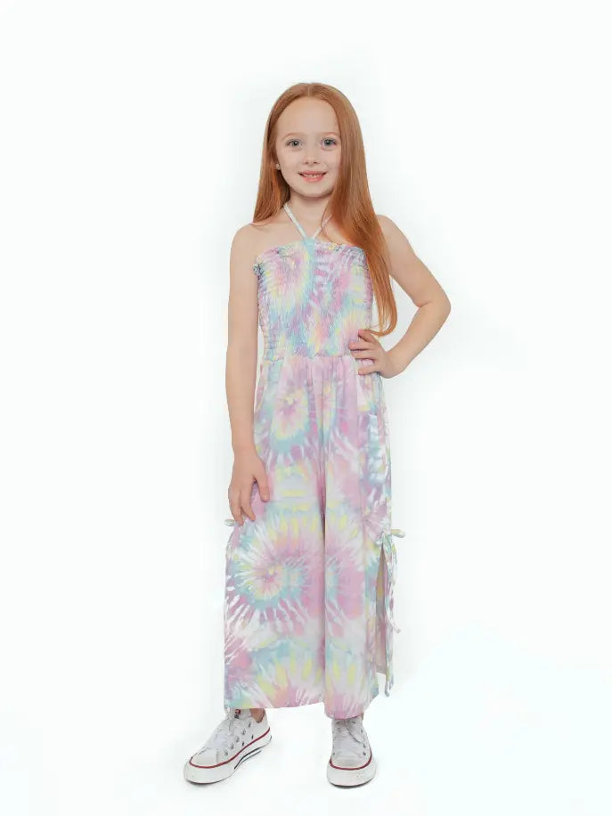 Girl's pastel tie-dye jumpsuit with smocked bodice and adjustable side ties, perfect for summer outings.