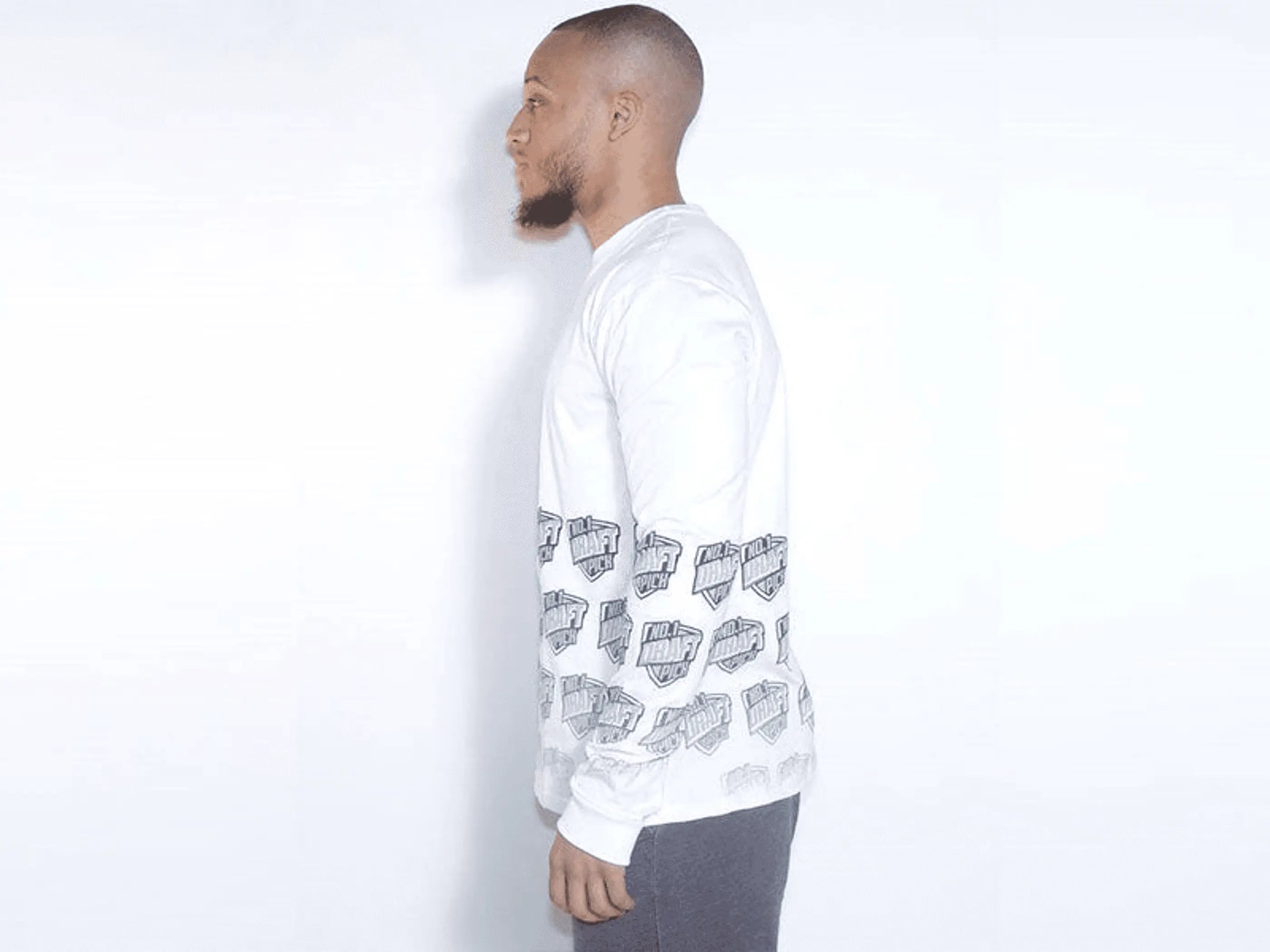 Men's white long-sleeve shirt with black graphic print on sleeves, casual style, cotton blend fabric.