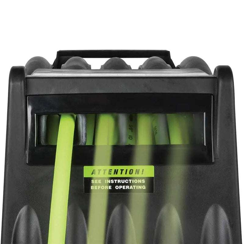 Green hose stored in a black durable reel, designed for easy access and organization in outdoor settings.