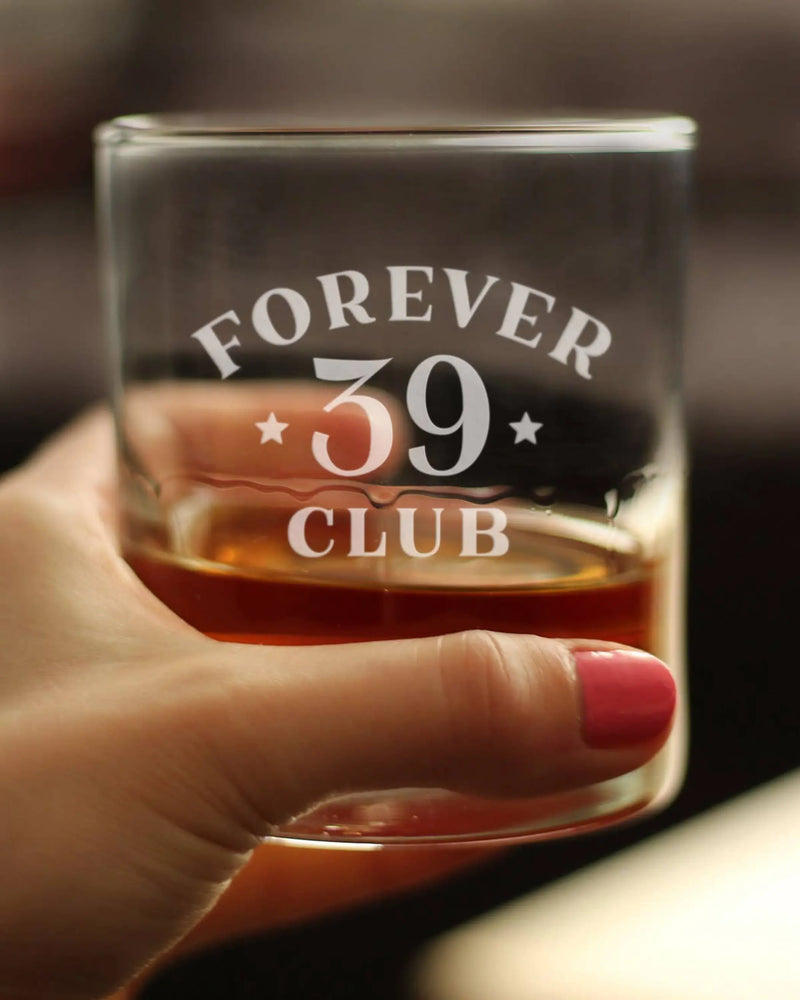 "Clear glass whiskey tumbler with etched 'Forever 39 Club' design, perfect for celebrations and gifts."