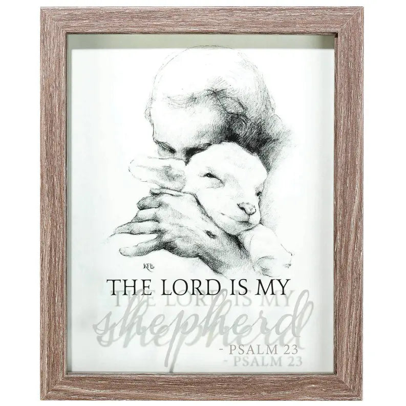 Framed artwork featuring a shepherd and lamb, gray tones, wood finish, Psalm 23 inspirational decor.