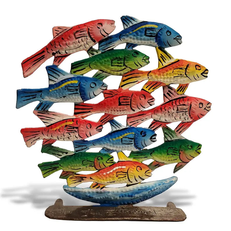 Colorful wooden fish sculpture in blue, red, green, and yellow, featuring a unique, layered design with stable base.