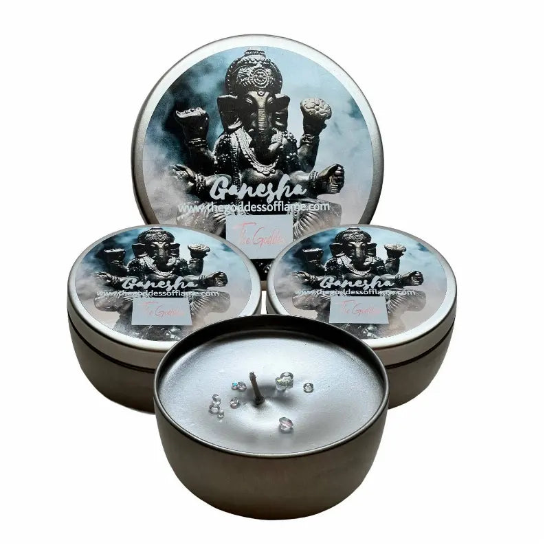 Ganesh-themed scented candles in silver tins with intricate details, featuring a calming essential oil blend.