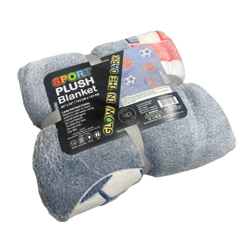 Sport plush blanket in blue and red, soft fabric, 60"x50", features glow-in-the-dark sports design.