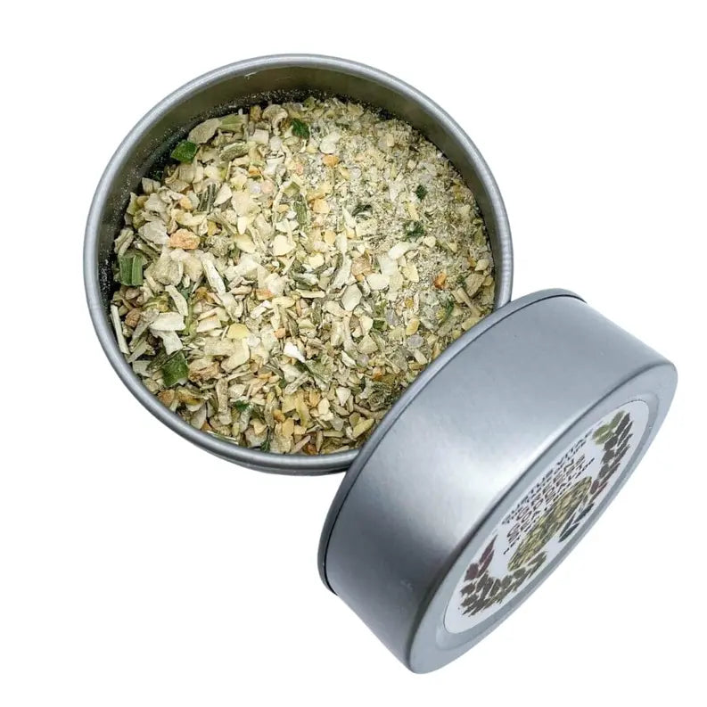 Dried herb blend in a silver tin, featuring a mix of green and brown flakes, ideal for cooking and seasoning.