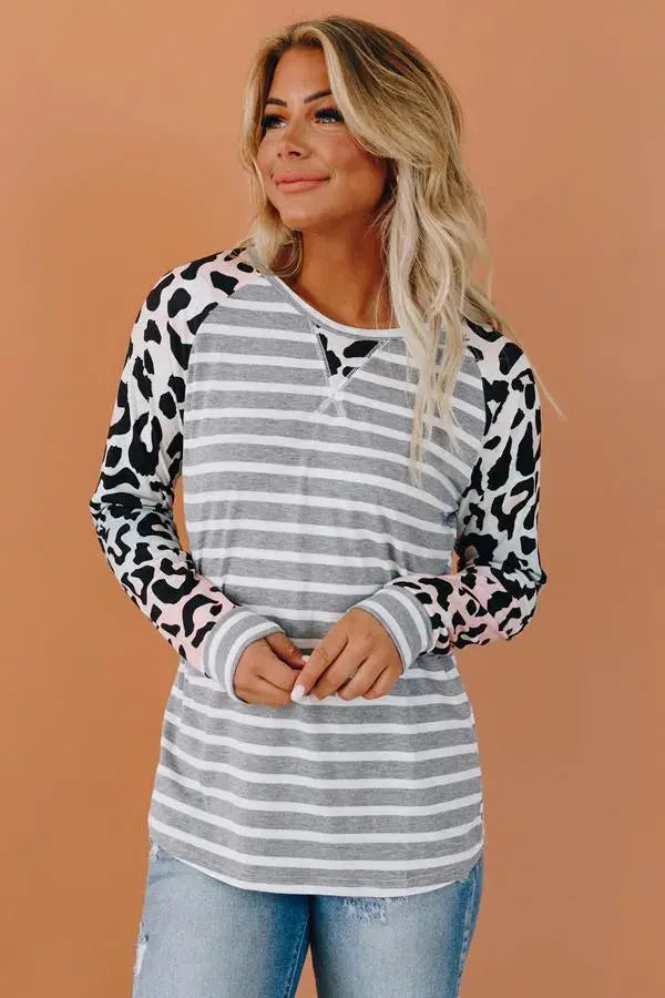 Gray striped long sleeve shirt with leopard print sleeves and light pink accents, perfect for casual wear.
