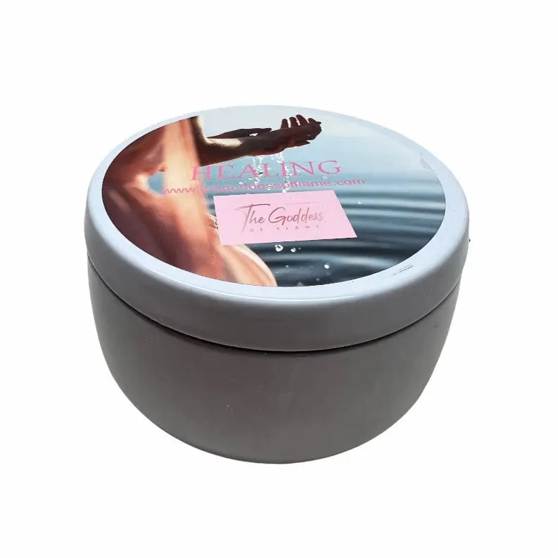 Gray ceramic healing candle with a minimalistic design, featuring a serene image and "The Goddess" label.