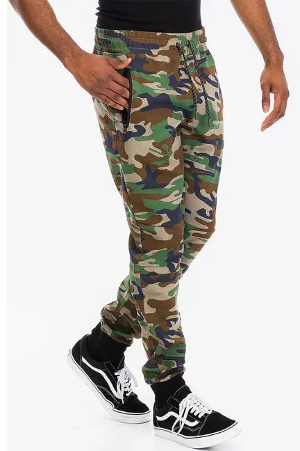 Men's camo joggers in green, brown, and blue, featuring an elastic waistband and cuffs, perfect for casual wear.