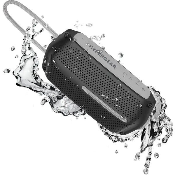 Black waterproof Bluetooth speaker with a textured surface and metal accents, splashing water around it.